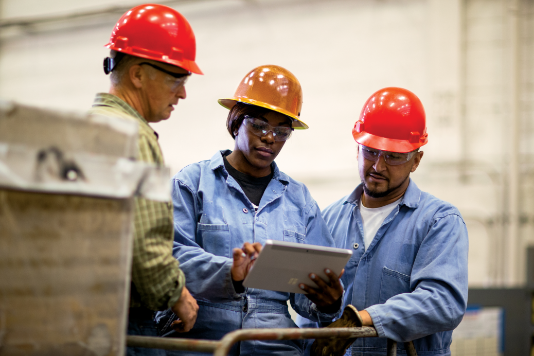 Shop Field Service workers meet with operations manager and team members