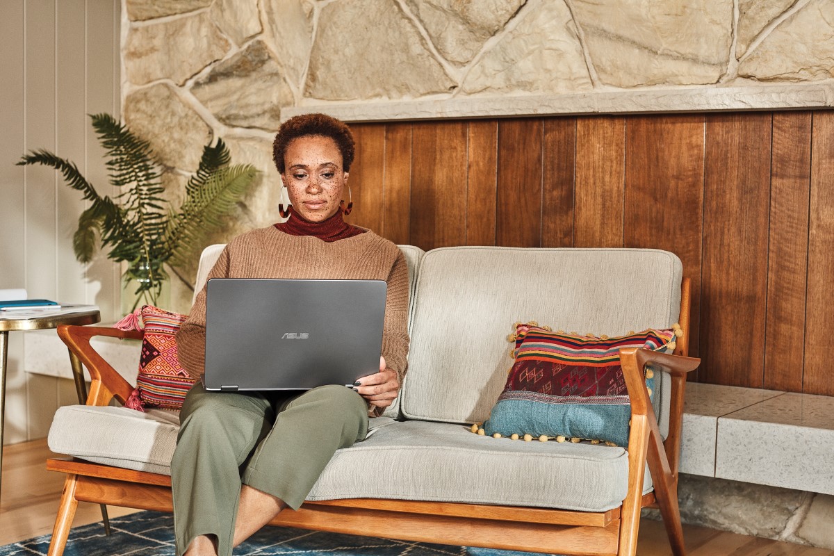 Woman interacting with an Asus laptop