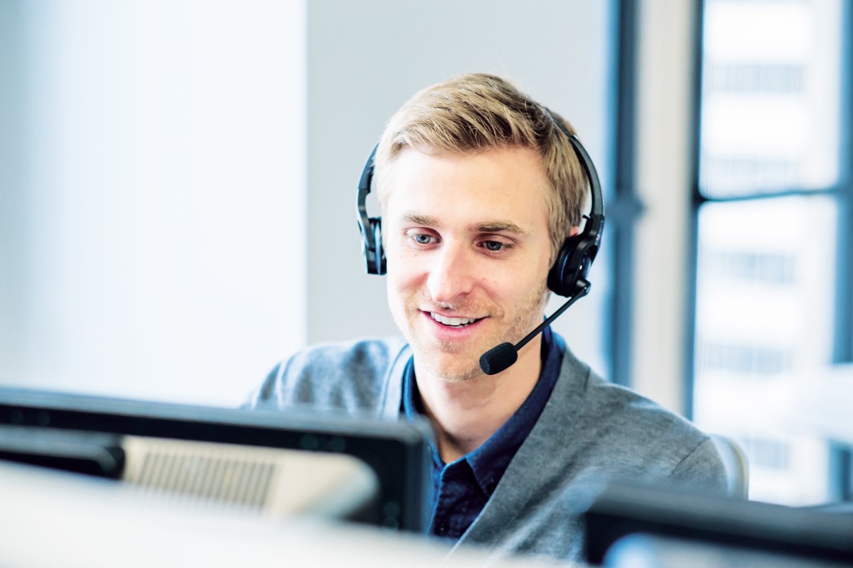 Man with headset at computer