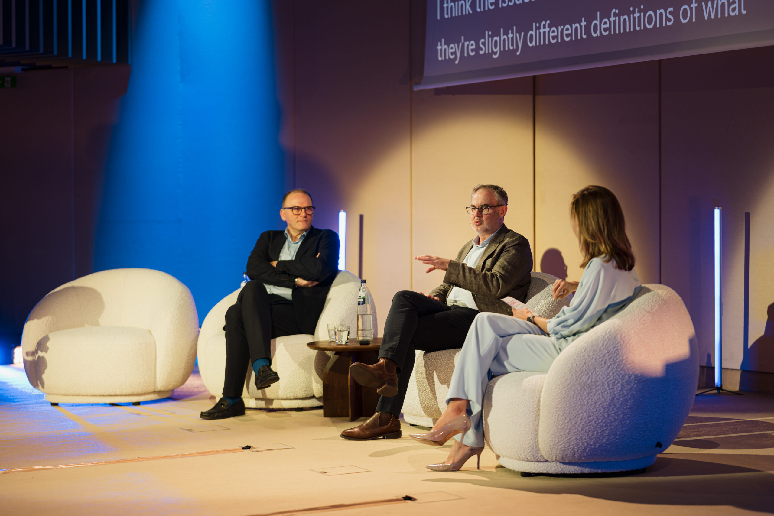Three leaders speak on stage at the 2026 Microsoft Digital Sovereignty Summit