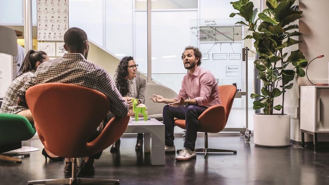 A group of people in a meeting