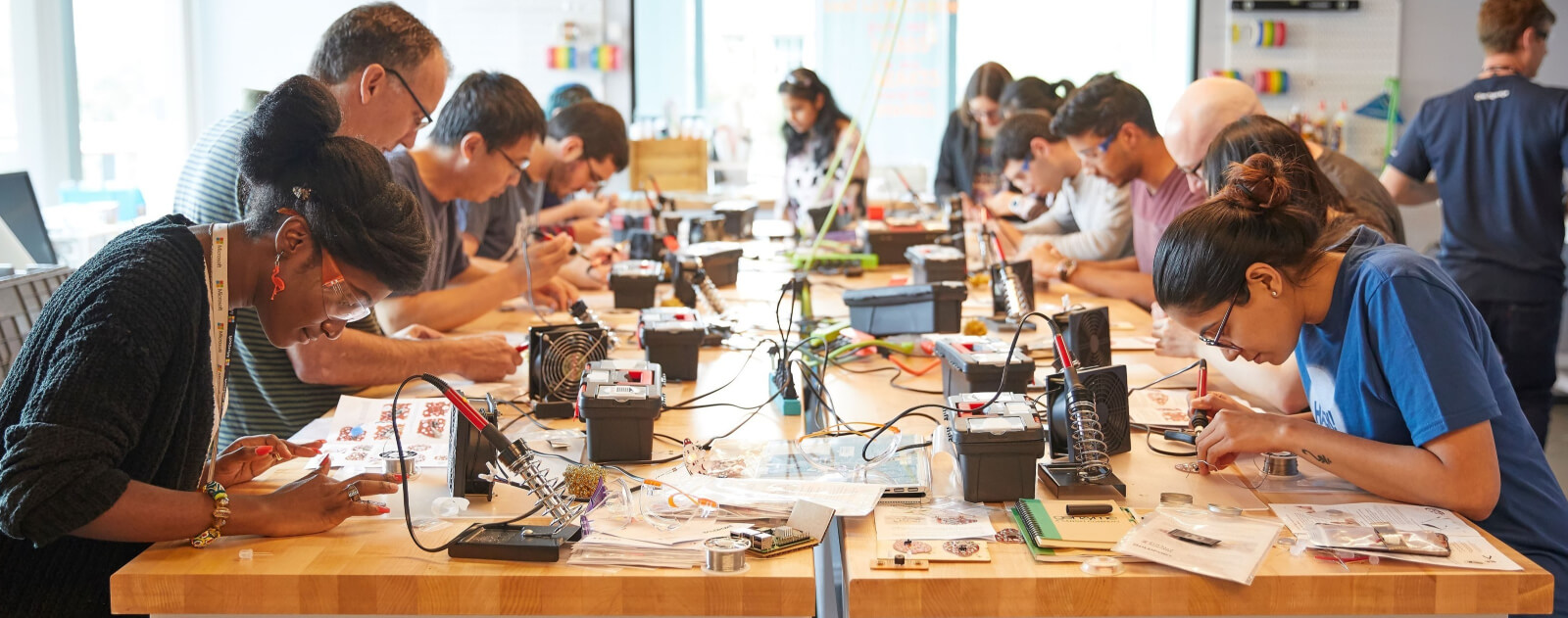 A group of people working together in a Garage workspace.