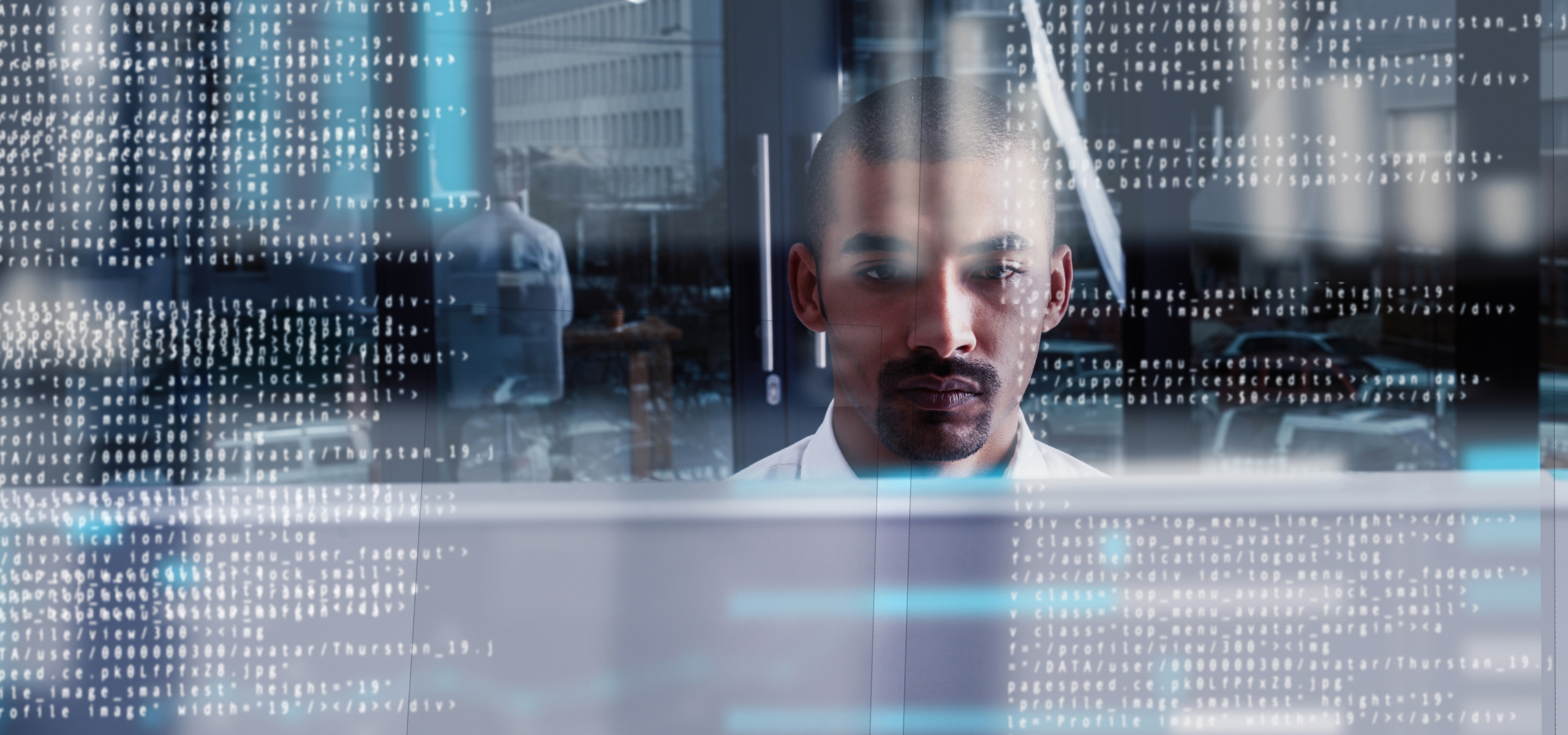 Cropped shot of a young computer programmer looking through data.