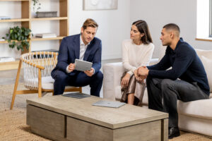 a meeting and looking at a Surface device.