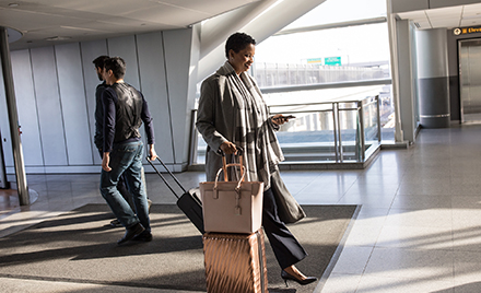 Image of an enterprise female in business travel at airport