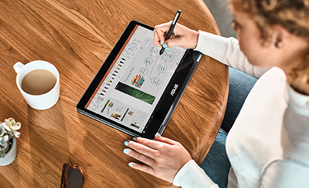 Image of a woman using a pen on a tablet