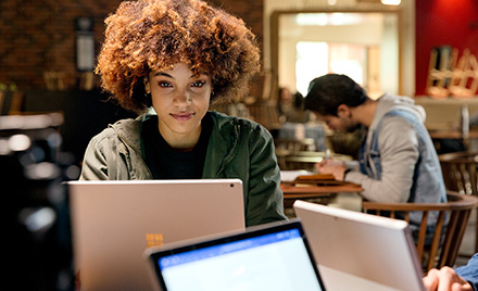 Image of an office worker working on her computer