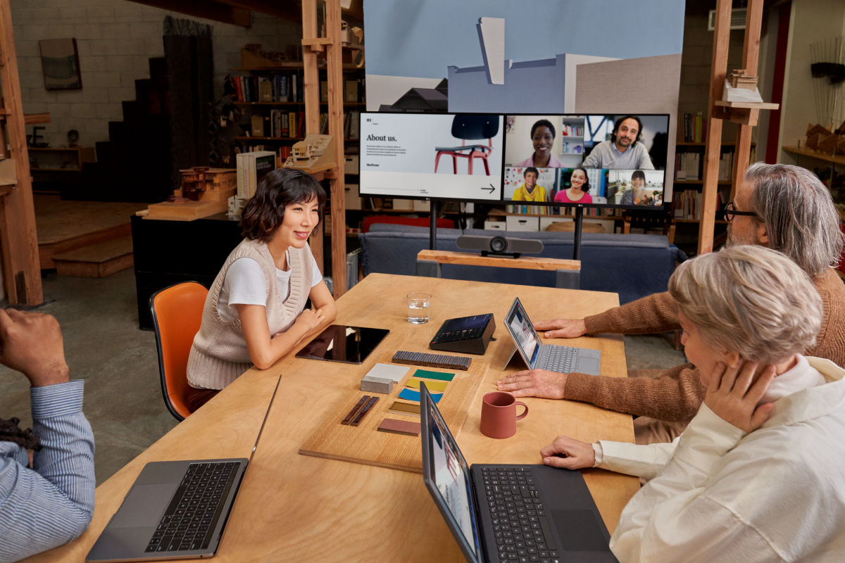 Group of coworkers collaborating in modern hybrid work space