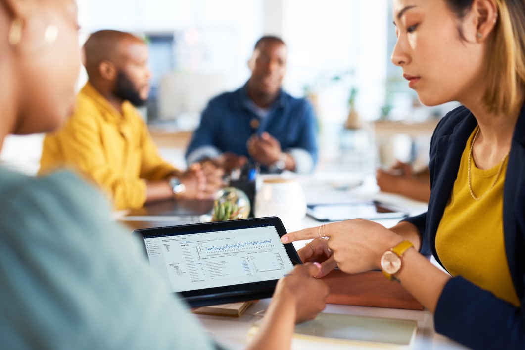 Tablet, graphs and teamwork of women on data, infographic review and dashboard logistics