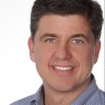 a close-up of a man smiling James Phillips