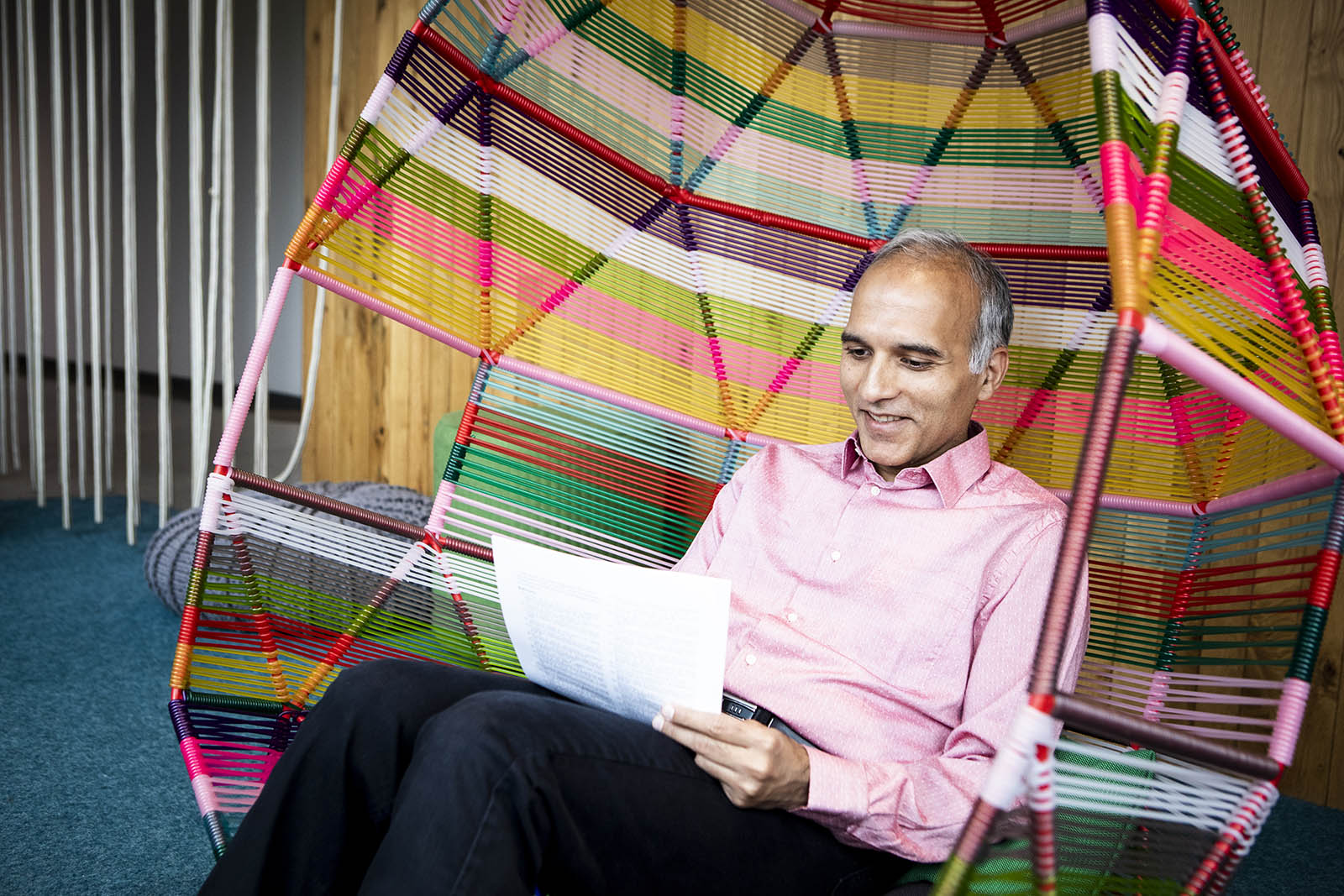 Sumit Gulwani sitting in a colorful chair