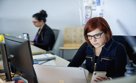 Image of an office worker at her desk