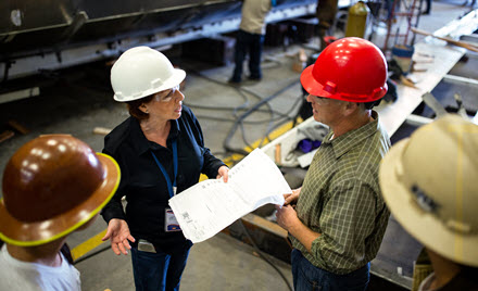 Image of workers on the floor in a factory