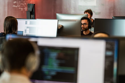 Image of a worker behind his desktop PC