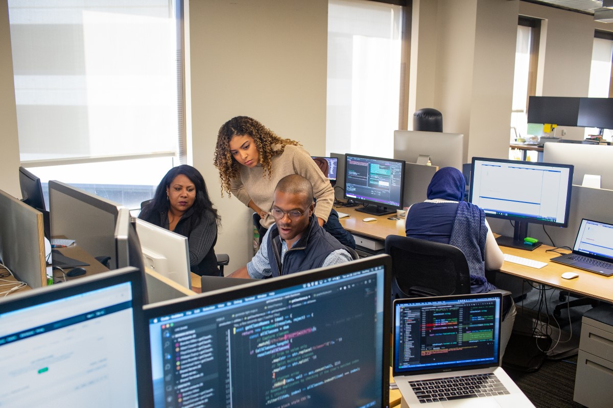 Developer manager collaborates with developer in enterprise developer work space