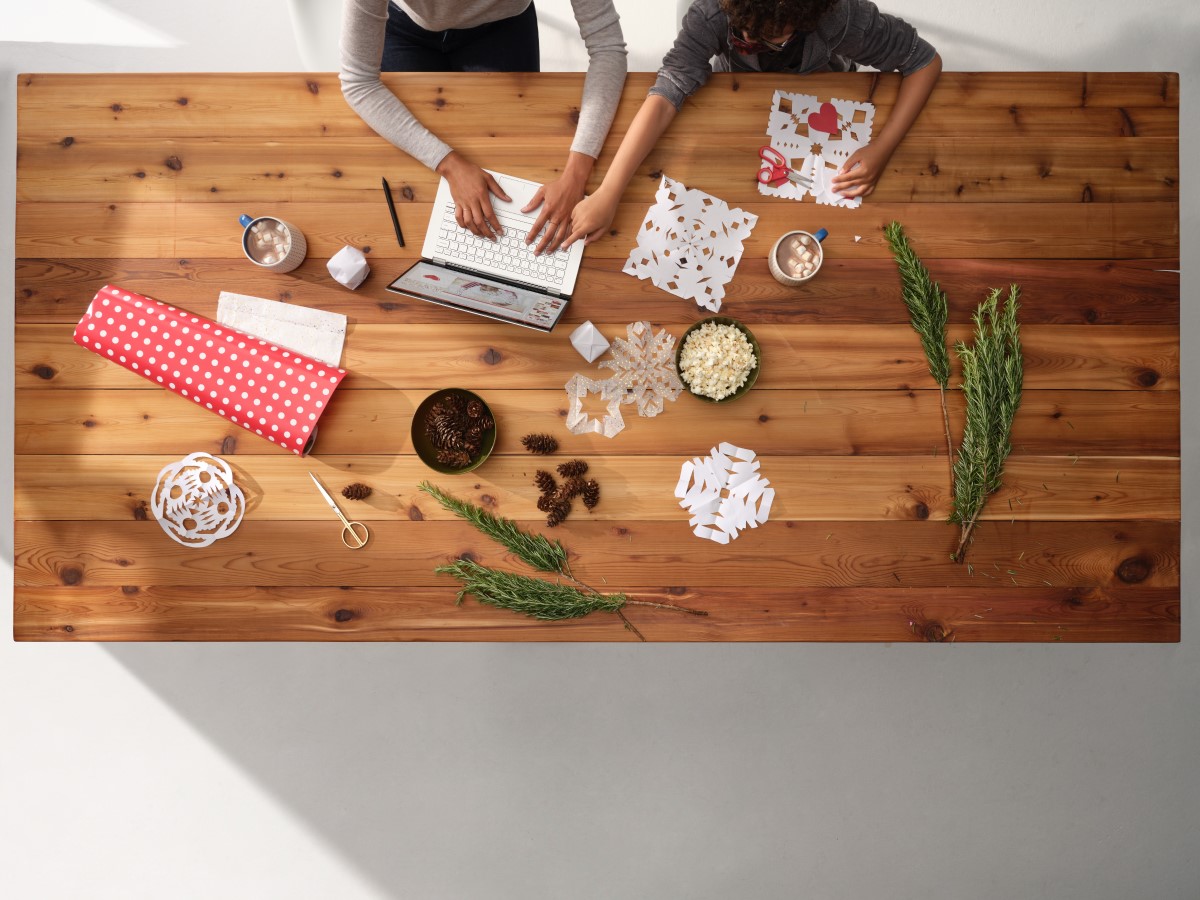 Parent making holiday cards with child