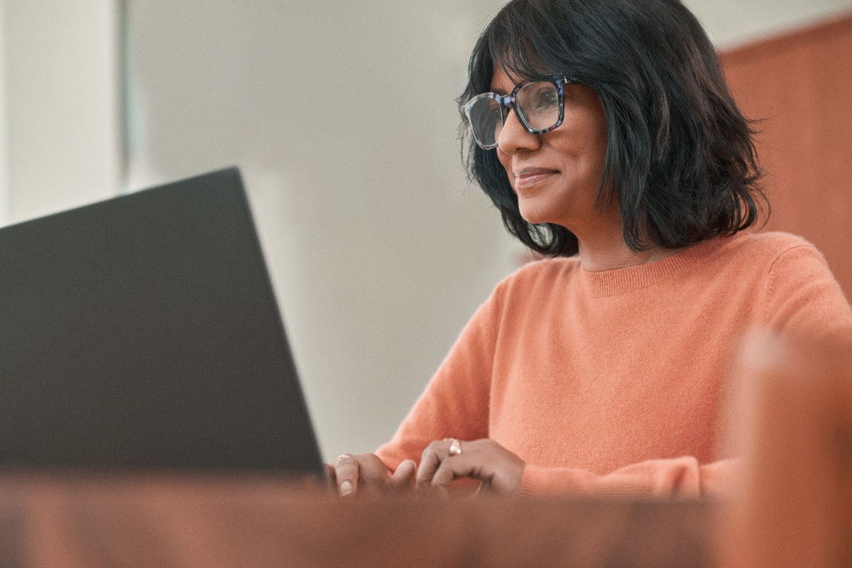 Adult woman working on laptop