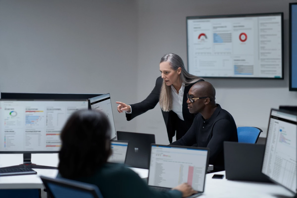 Chief information security officer collaborating with a practitioner in a security operations center