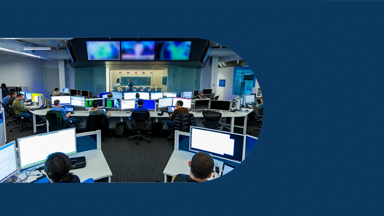 A group of security practitioners work at their computers