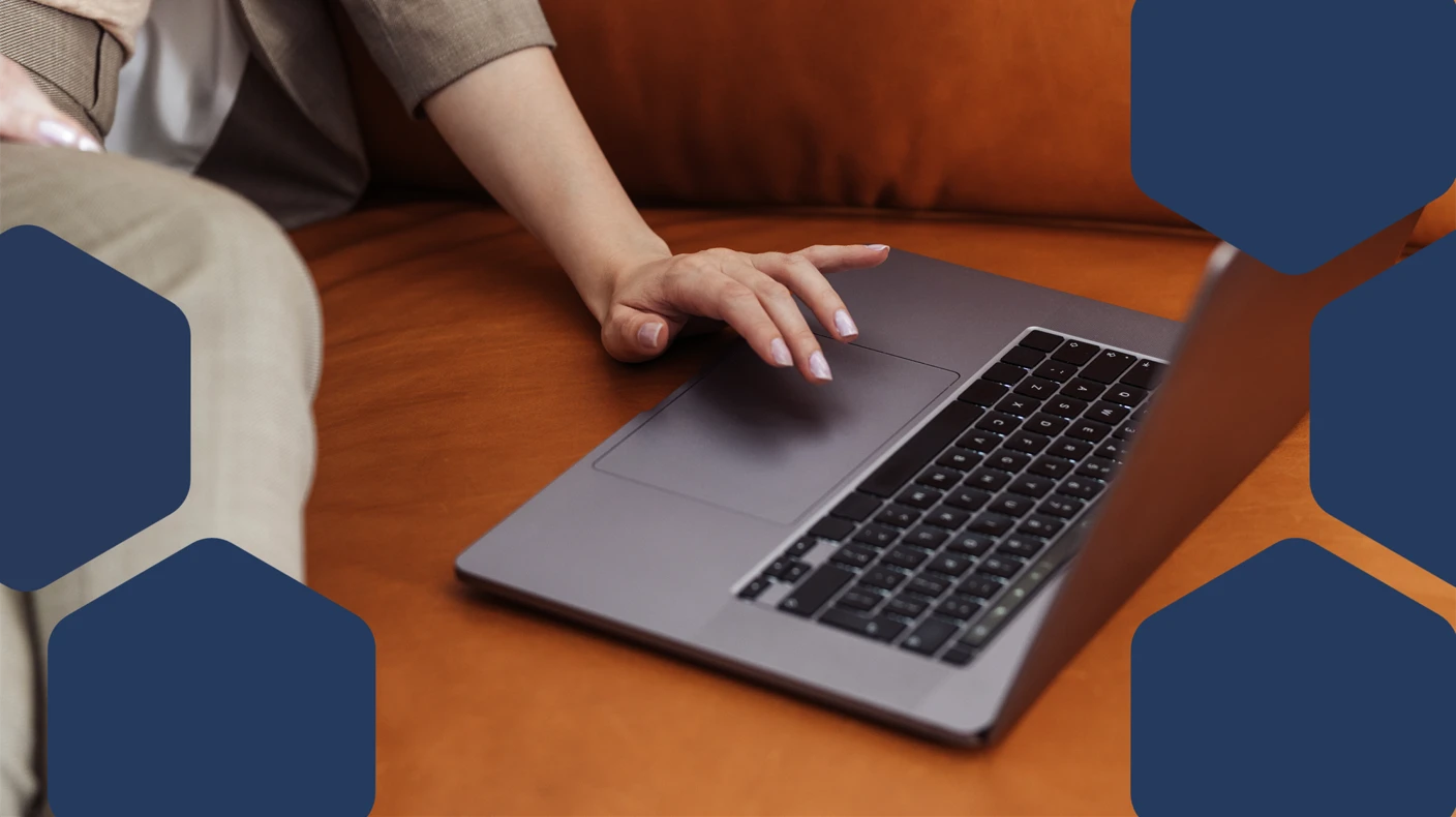 Person sitting on a couch using a laptop