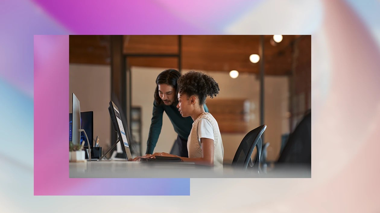 Two people sit at a computer