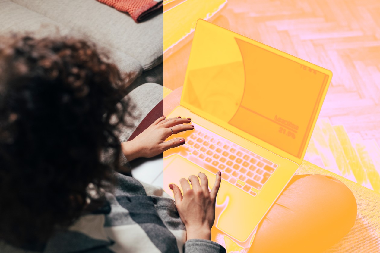 A person typing on a laptop