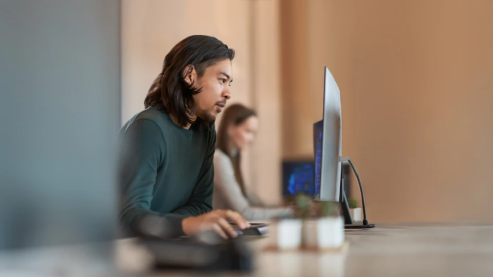 Enterprise office worker in focused work with a positive facial expression