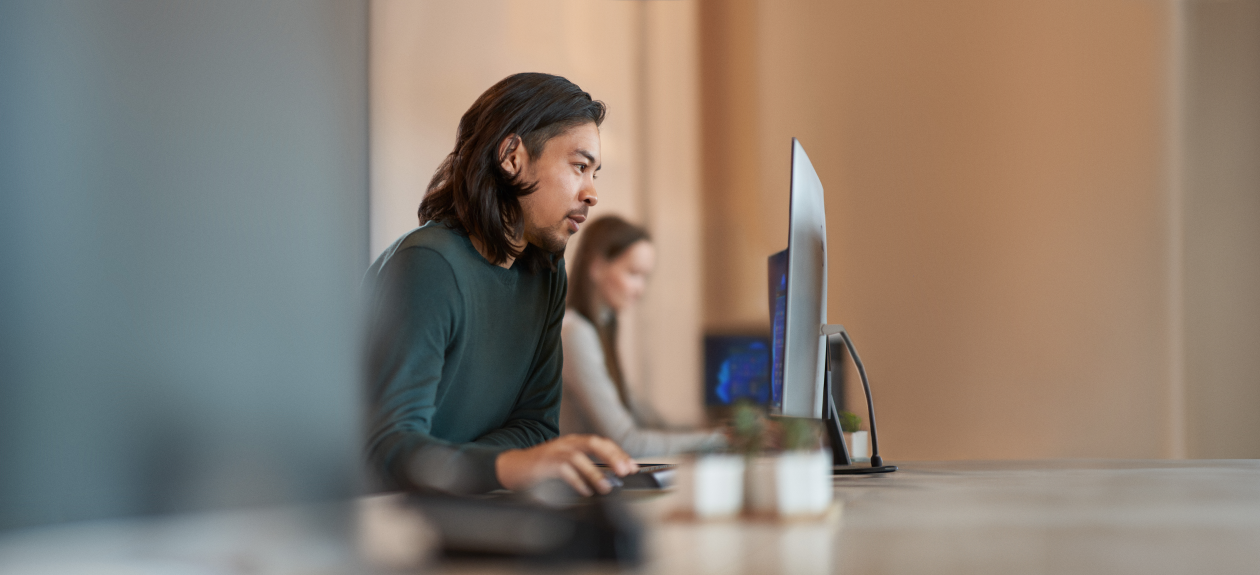 Enterprise office worker in focused work with a positive facial expression